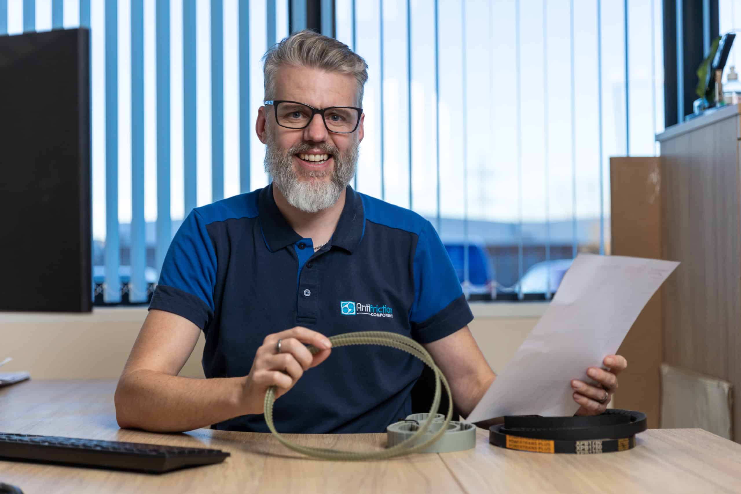 Antifriction male office worker smiling