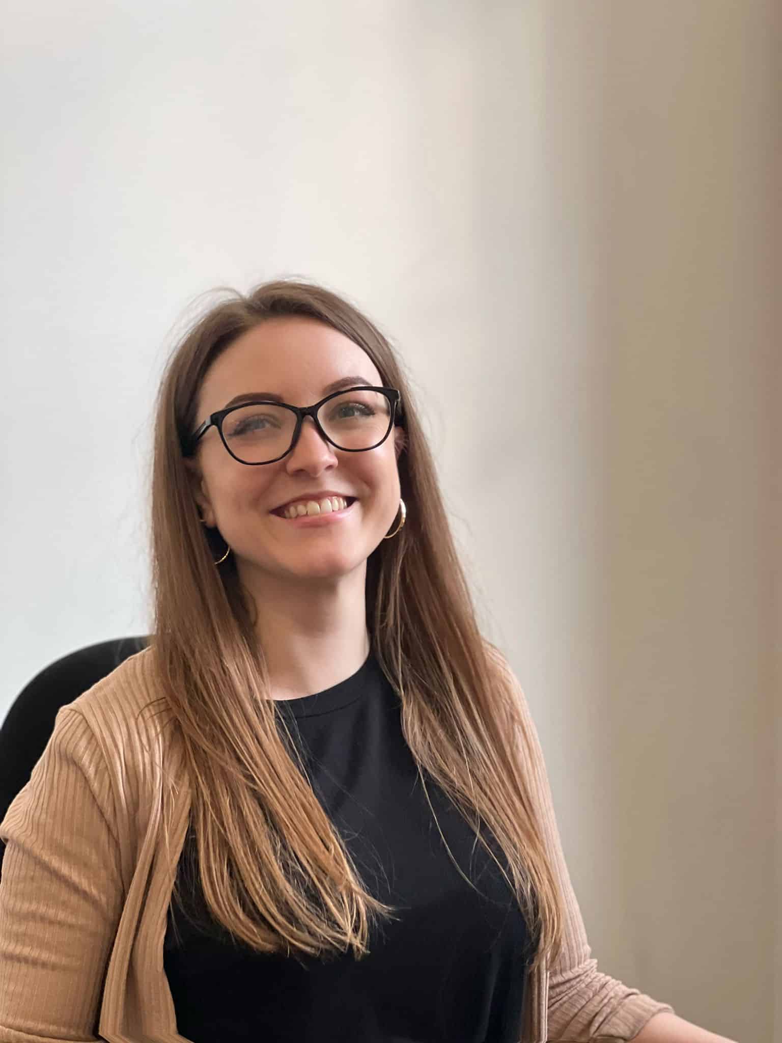 Headshot of Becky Hesilrige, Marketing Manager at MaxOptra