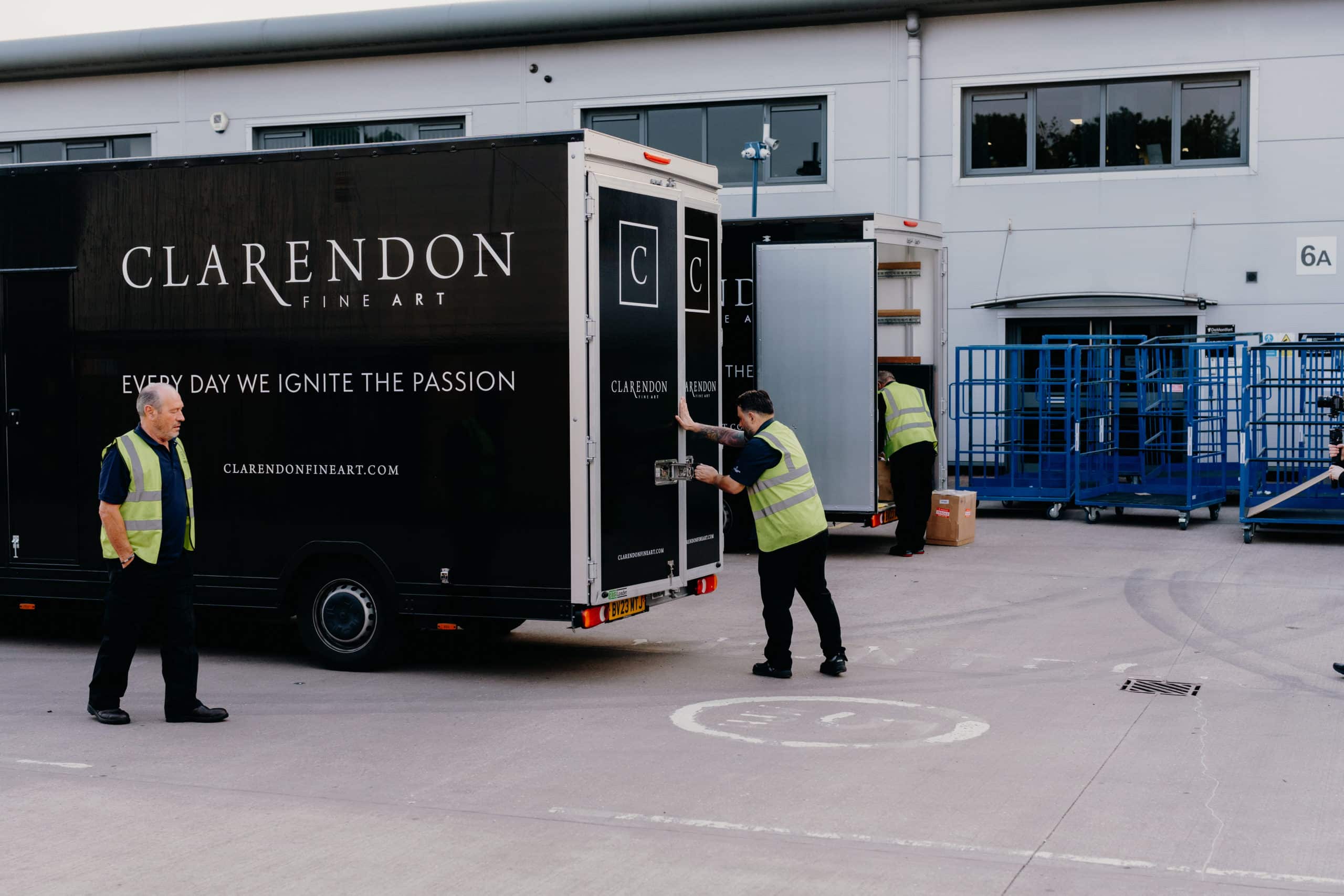 Image of Clarendon Fine Art delivery van - with drivers offloading artwork