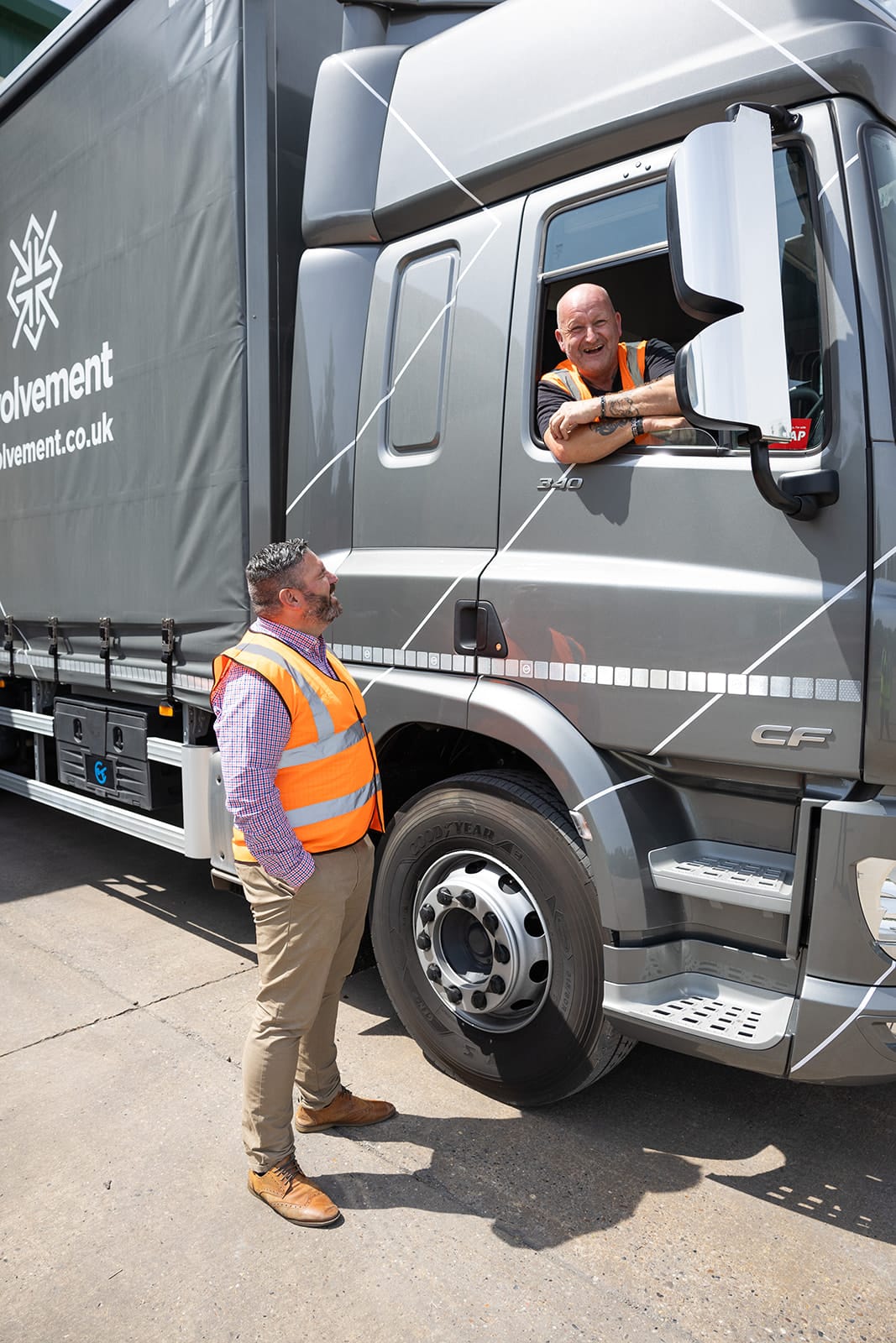 Involvement drivers chatting next to a branded van