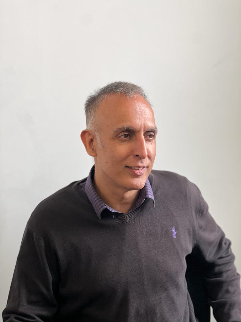 Headshot of Sanjay Gandhi, Managing Director at MaxOptra
