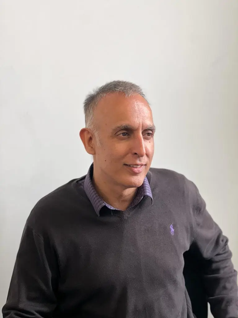 Headshot of Sanjay Gandhi, Managing Director at MaxOptra