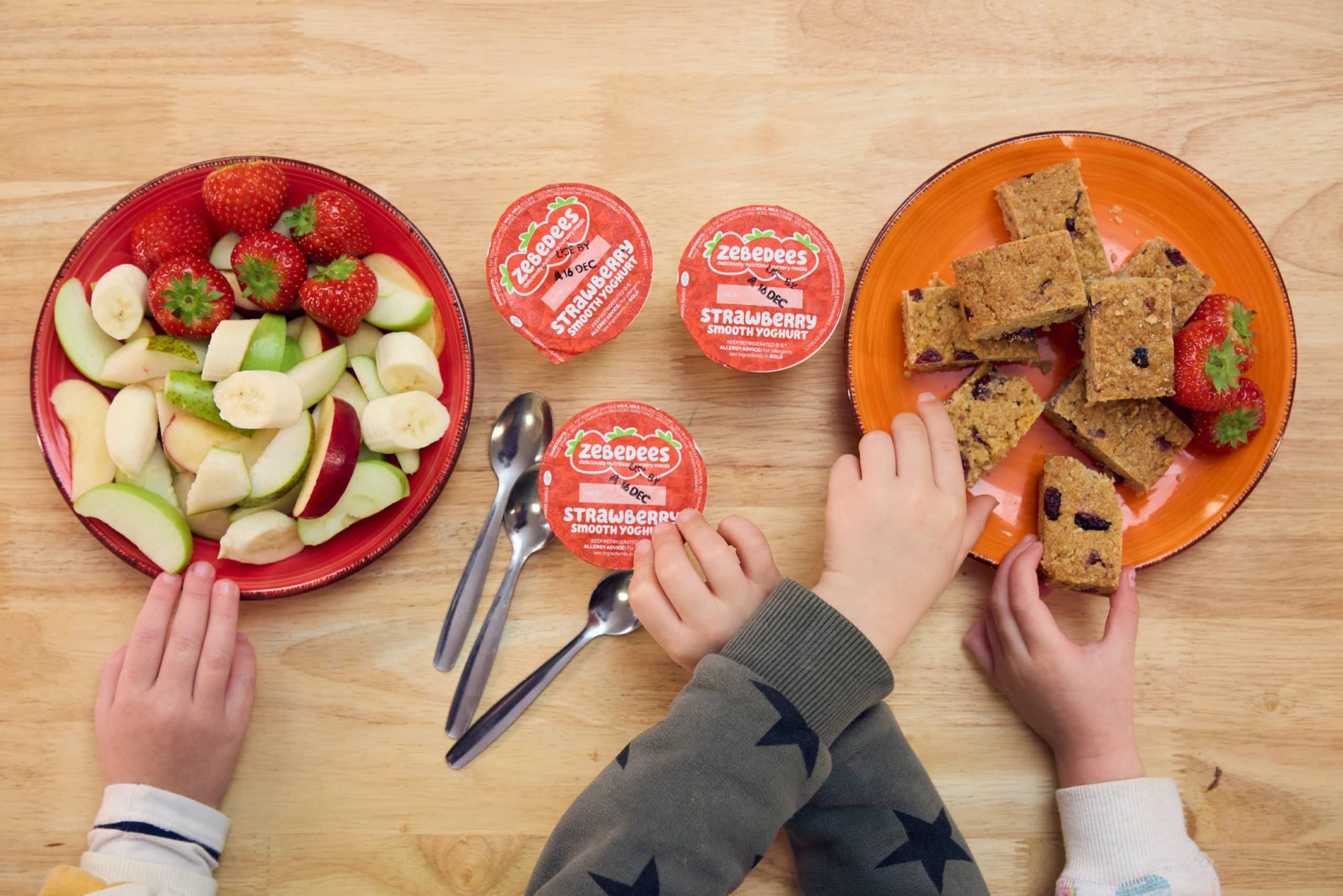 Image of Zebedees nursery meals on brighly coloured plates