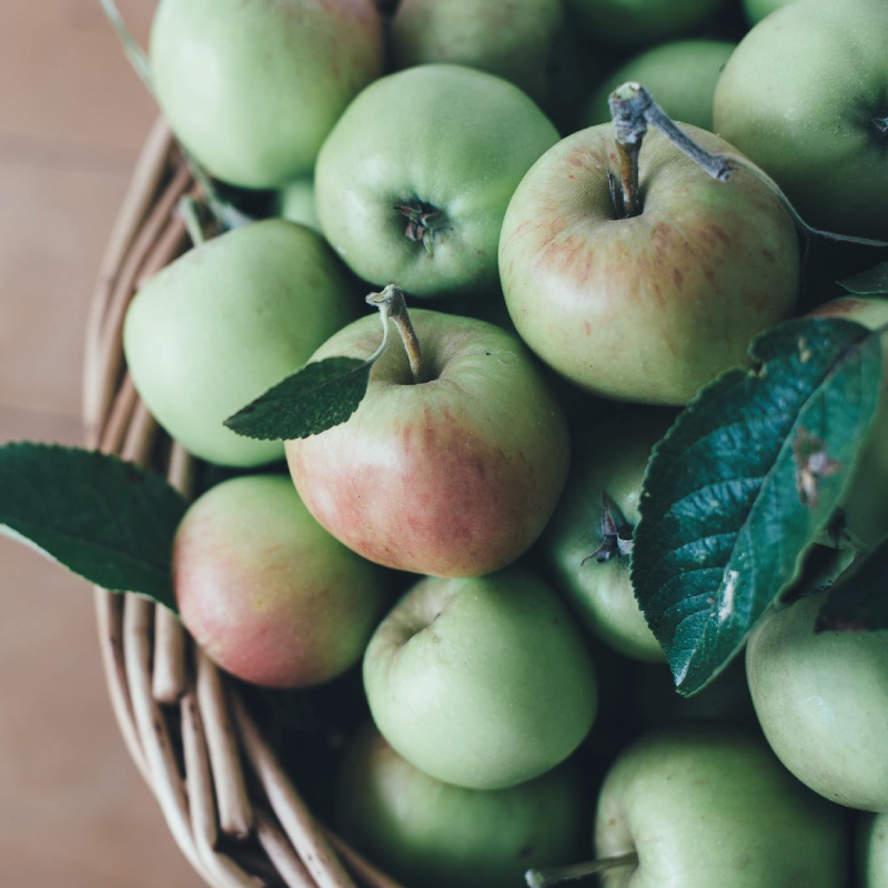 Green apples in a basket